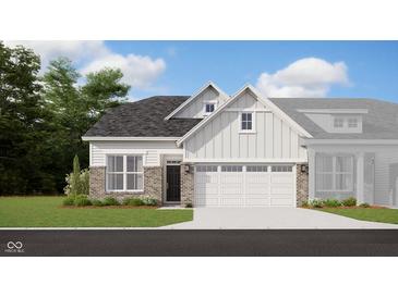 Charming single-Gathering home with brick and white siding, complemented by a two-car garage and well-manicured lawn at 7572 Bluegill Dr, Noblesville, IN 46062
