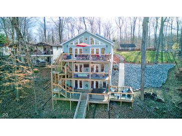 Unique three-story home with multiple decks offering stunning outdoor living spaces at 8205 Bass Dr, Nineveh, IN 46164