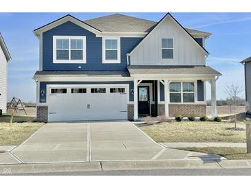 Inviting two-story home with a modern blue and white exterior and a two-car garage at 8626 Jeff Cir, Brownsburg, IN 46112
