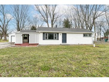 Charming single story home with white siding, covered porch and well-maintained lawn at 9923 N 125 W, Fortville, IN 46040