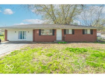 Ranch style home featuring a mix of brick and siding with a grassy front yard at 4113 Gambel Rd, Indianapolis, IN 46221