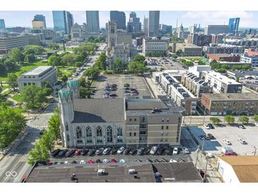 An aerial view shows the property in a vibrant downtown location, near other apartments and businesses at 802 N Meridian St # 204, Indianapolis, IN 46204