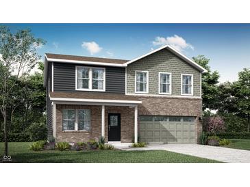 Charming two-story home featuring a brick and siding exterior with an attached two car garage and well manicured lawn at 11608 Hartwell St, Indianapolis, IN 46235