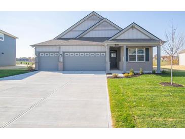Charming single-Gathering home featuring a two-car garage and well-maintained front lawn at 2268 Oakmont Dr, Plainfield, IN 46168