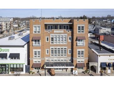 Classic brick building exterior featuring the 'Lurie' sign, awnings and balconies at 30 W Main St # 3D, Carmel, IN 46032