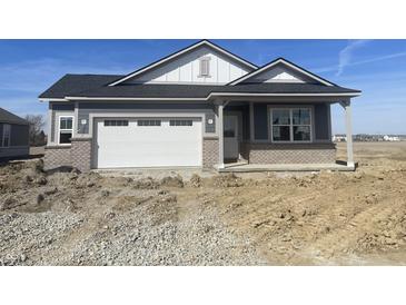 Charming single-Gathering home featuring an attached garage and a covered front porch at 5320 W Glenview Dr, McCordsville, IN 46055