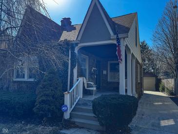 Charming two-story home with a well-maintained lawn and classic architectural details at 850 N Butler Ave, Indianapolis, IN 46219