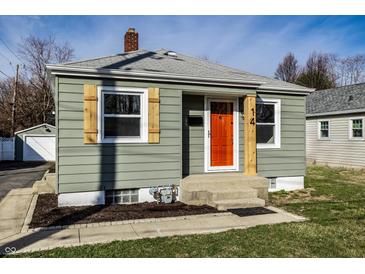 Charming home with a bright orange door and attractive window shutters at 14 N Edmondson Ave, Indianapolis, IN 46219