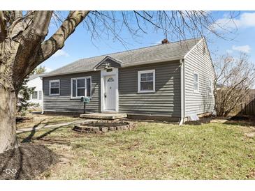 Charming home exterior features light gray siding, a front yard, and inviting entryway at 2315 Caldwell Pl, Columbus, IN 47201