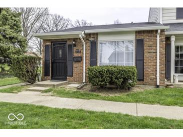 Charming brick home with a well-maintained front yard and dark shutters at 741 Southfield Ct, Indianapolis, IN 46227