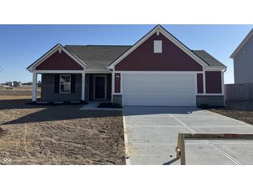 A charming home with a two-car garage, red siding, and a well-manicured lawn, ready for new owners at 1195 Andromeda Dr, Franklin, IN 46131