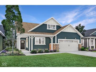 Charming two-story home with a well-manicured lawn and inviting front porch at 181 Cline St, Westfield, IN 46074