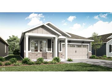 Charming single-story home featuring a covered porch, attached garage, and landscaped front yard at 19574 Boulder Brook Ln, Westfield, IN 46074