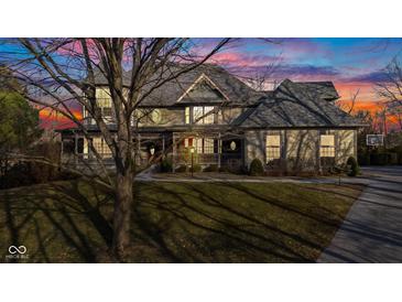 Stunning two-story home featuring a beautiful wrap-around porch and lush lawn at 3608 Olive Branch Rd, Greenwood, IN 46143