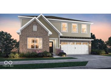 Beautiful two-story home with a brick facade and a two-car garage at 7523 Fallsworth Dr, Avon, IN 46123