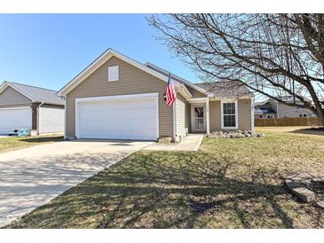 Charming single-Gathering home featuring a well-maintained lawn and attached two-car garage at 1269 Frogs Leap, Cicero, IN 46034