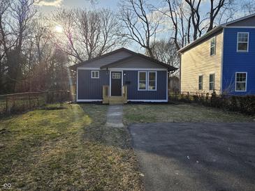Charming single-story home with freshly painted siding and a well-manicured lawn at 3262 Orchard Ave, Indianapolis, IN 46218