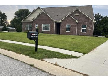 Beautiful brick single-story home featuring a well-manicured lawn and a charming mailbox at 10890 Poppy Hill Dr, Indianapolis, IN 46234