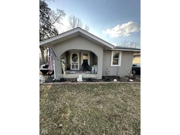 Charming covered front porch with seating and tasteful decor, creating a welcoming entrance at 340 N Eaton Ave, Indianapolis, IN 46219