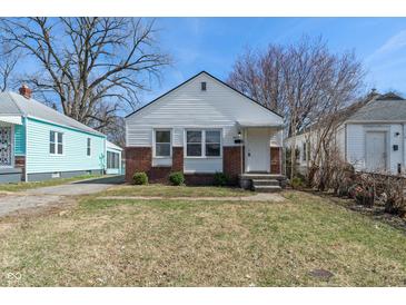 Charming single-Gathering home with white siding, brick accents, and a well-maintained front lawn at 3505 Ralston Ave, Indianapolis, IN 46218