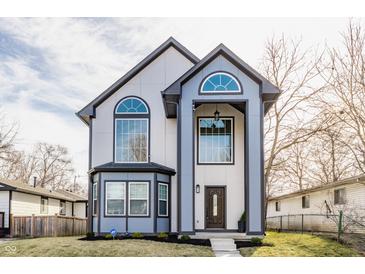 Stunning two-story home with modern design, large windows and manicured landscaping at 1533 Harlan St, Indianapolis, IN 46203