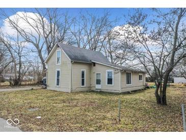 Quaint exterior of home with mature trees and a simple yard at 2123 N F St, Elwood, IN 46036