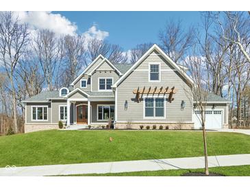 Beautiful two-story home featuring well-maintained landscaping and gray accents at 10756 Dartmoor Way, Zionsville, IN 46077
