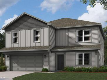Charming two-story home featuring vertical siding, a gray roof, manicured lawn, and an attached two-car garage at 3296 W Longbranch Dr, Monrovia, IN 46157