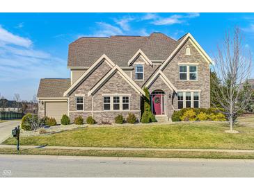 Attractive brick home featuring a manicured lawn and inviting curb appeal at 5842 Oakmont Blvd, Bargersville, IN 46106