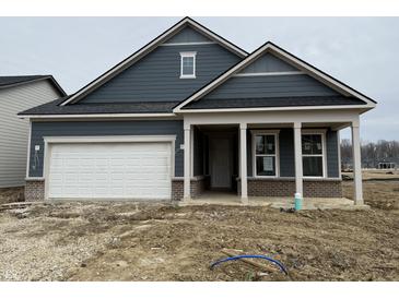 Charming single-Gathering home with a two-car garage and covered porch situated on a construction lot at 14859 Amber Light Dr, Westfield, IN 46074