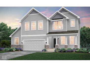 Beautiful two-story home featuring gray siding, a two-car garage, and manicured landscaping at 16467 Alps Rd, Noblesville, IN 46060