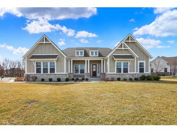 Charming home featuring a manicured lawn, stone accents, and inviting entrance at 16544 Gaither Ct, Westfield, IN 46074