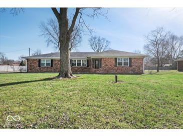 Charming single-story brick home featuring a well-maintained lawn and mature tree at 1721 Rachel Dr, Plainfield, IN 46168