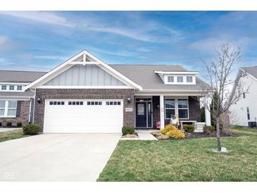 Charming single-story home featuring a brick facade, well-manicured lawn, and an attached two-car garage at 19252 Chestnut Grove Ln, Noblesville, IN 46062