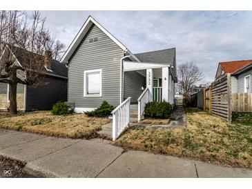Charming gray home with a cozy front porch and neat landscaping at 3732 N Kenwood Ave, Indianapolis, IN 46208