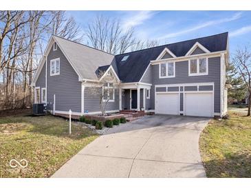 Inviting two-story home featuring a well-manicured lawn and an attached two-car garage at 10249 Southwind Dr, Indianapolis, IN 46256