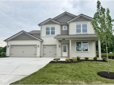 Charming two-story home featuring a three-car garage and a well-maintained front yard at 1618 Trichel Dr, Greenwood, IN 46143