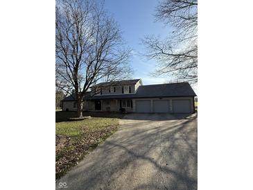 Charming two-story home featuring stone accents and an attached three-car garage at 2100 Sunnybrook Ln, Lebanon, IN 46052
