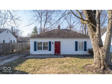 Charming single-story home featuring a red front door and classic blue shutters at 2207 E Dudley Ave, Indianapolis, IN 46227