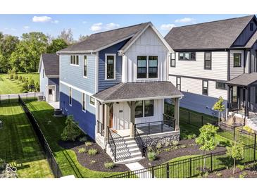 Charming two-story home with a welcoming front porch and beautifully landscaped yard at 11505 Langton Walk, Zionsville, IN 46077