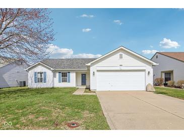 Charming single-story home with white siding, blue shutters, well-maintained lawn, and attached two-car garage at 1156 E Mill Run Blvd, Greenfield, IN 46140