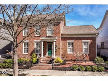 Charming brick home with well-manicured landscaping and a welcoming front entrance at 12569 Branford St, Carmel, IN 46032