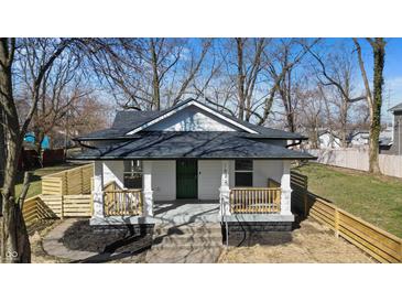 Charming renovated home with a inviting front porch and newly landscaped yard at 1822 N Dexter St, Indianapolis, IN 46202