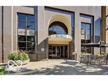 Beautiful exterior view of the building with large windows and outdoor seating area at 110 E Washington St # 802, Indianapolis, IN 46204