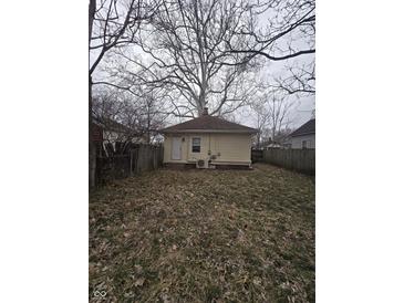 Spacious backyard featuring a lawn and a fenced perimeter, great for outdoor activities at 1410 St Paul St, Indianapolis, IN 46203