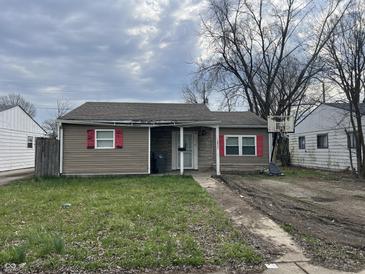 Cozy home with neutral siding, red shutters, and a small front yard at 2813 Baltimore Ave, Indianapolis, IN 46218