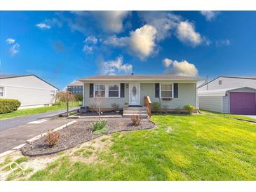 Charming single-story home with well-manicured lawn and beautiful landscaping at 868 Glendale Dr, Franklin, IN 46131