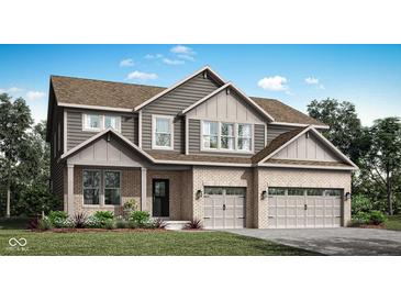 Beautiful two-story home with brick and gray siding, attached two car garage and well-manicured lawn at 11640 Aubrey Ln, Fishers, IN 46040