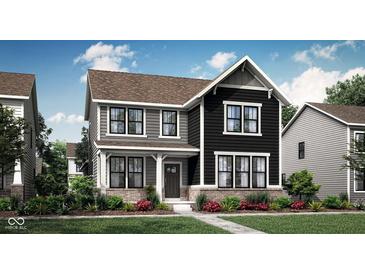 Charming two-story home featuring a mix of gray and black siding, brick accents, and a welcoming front porch at 20147 Chad Hittle Blvd, Westfield, IN 46074