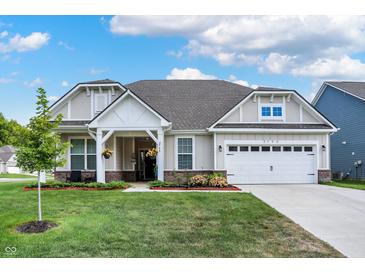 Charming single-story home with a well-manicured lawn and inviting front porch at 2795 Lanai Ln, Greenwood, IN 46143